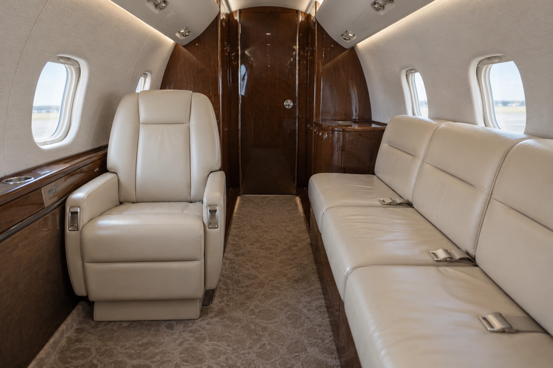 BAe 125 Series 800A / Hawker 800 cabin interior illustration: hawker 800A eight-passenger example. Illustrative aft lounge detail, not a photograph of this aircraft. Four forward chairs are outside this view.