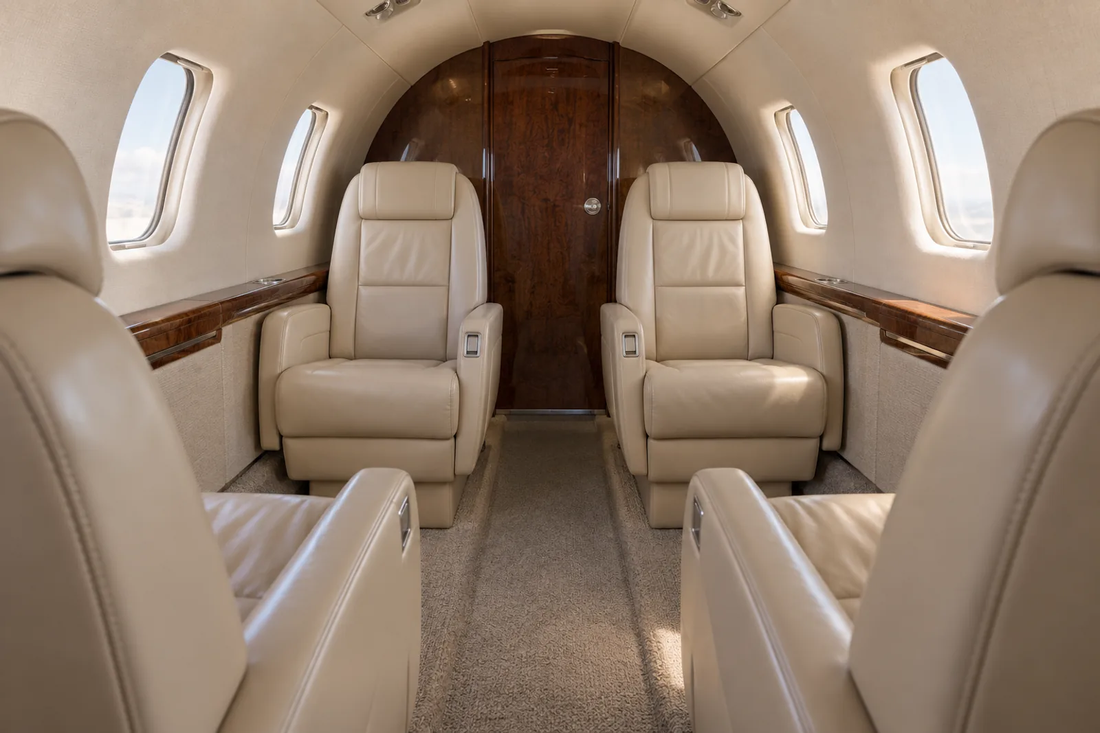 Cessna Citation Ultra cabin interior illustration: original illustration of the aft four-chair club in a representative Citation Ultra cabin.