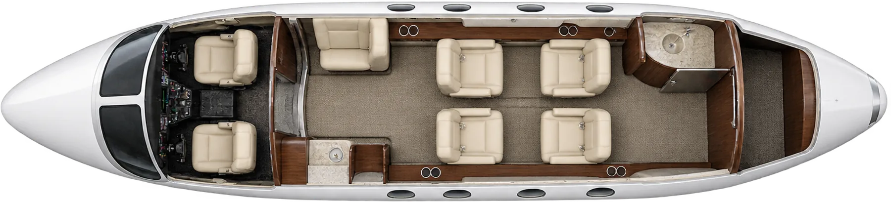Cessna CitationJet seat map illustration: top-down view of the cabin. Representative five-passenger layout: four club chairs and one forward side-facing chair; two pilots separate, aft unbelted lavatory. Individual interiors vary.