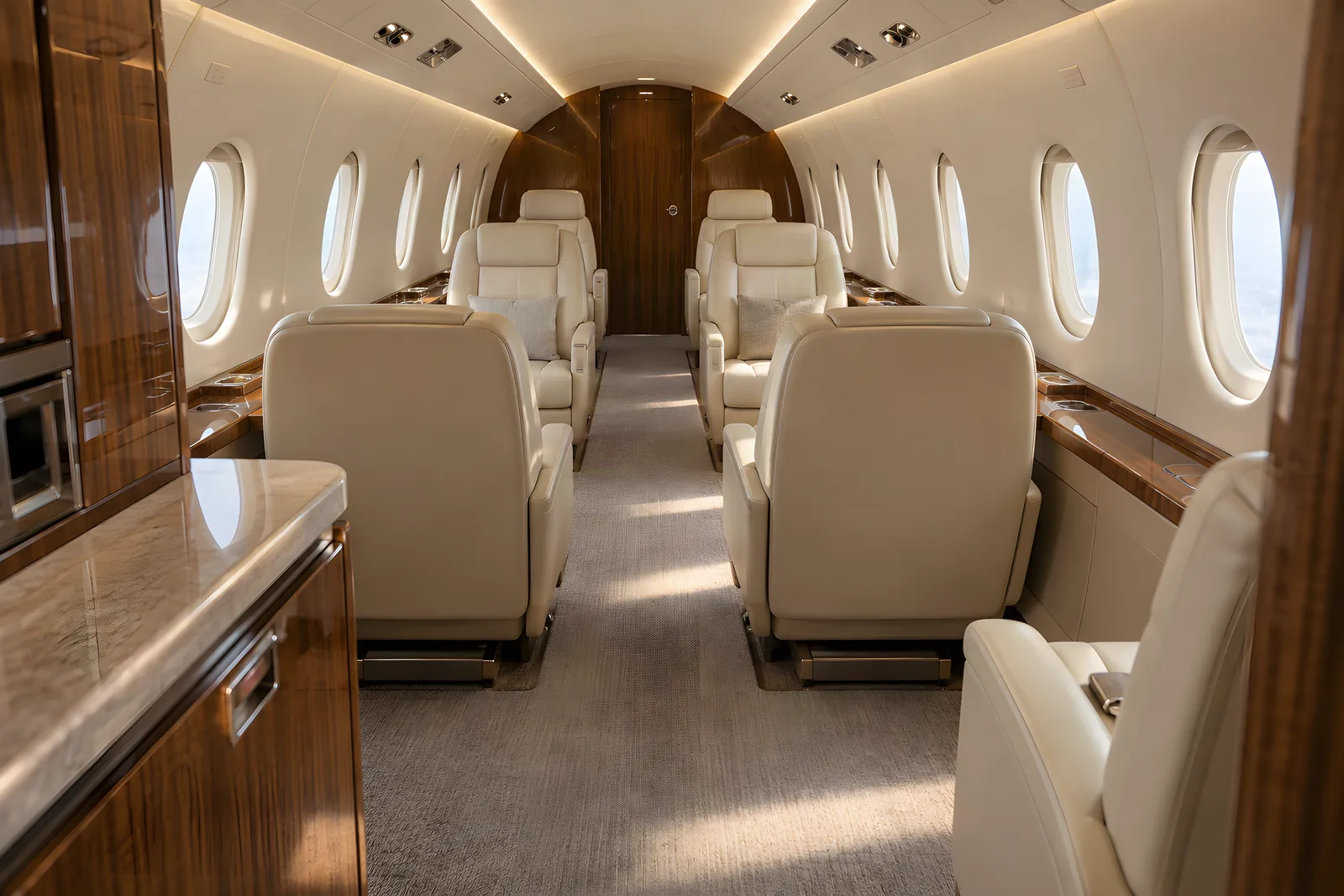 Embraer Praetor 500 cabin interior illustration: an eye-level view looking aft through an Embraer Praetor 500 cabin shows cream leather executive seats, warm wood veneer, upright oval windows and a flat central aisle beneath a six-foot arched ceiling.