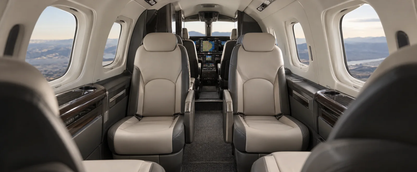 Piper PA-46-701TP (certified family) cabin interior illustration: aI-generated illustration of a representative Piper M700 Fury cabin, viewed from the cabin toward the cockpit.