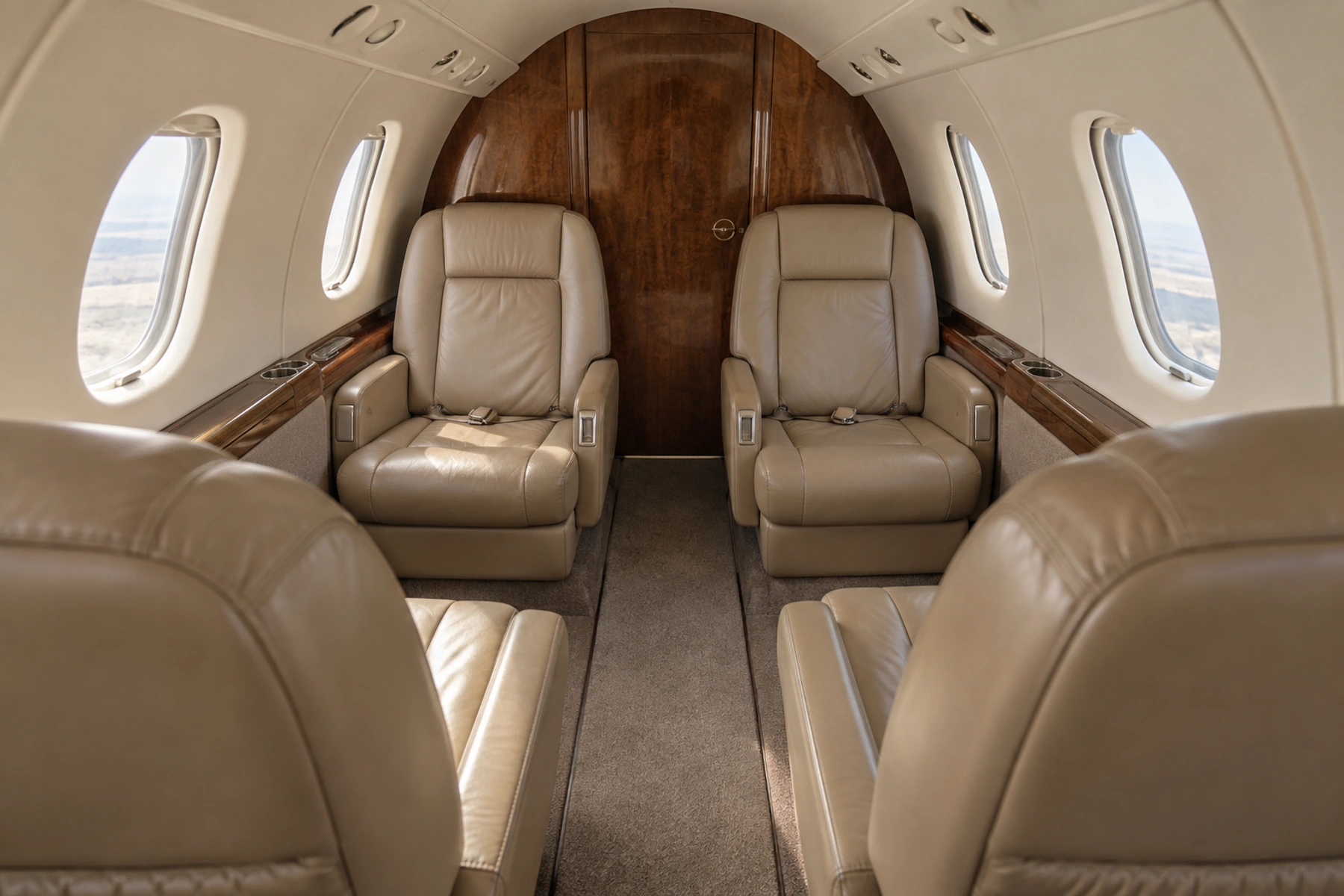Beechjet 400 seven-passenger example. Representative illustration; actual interiors vary.