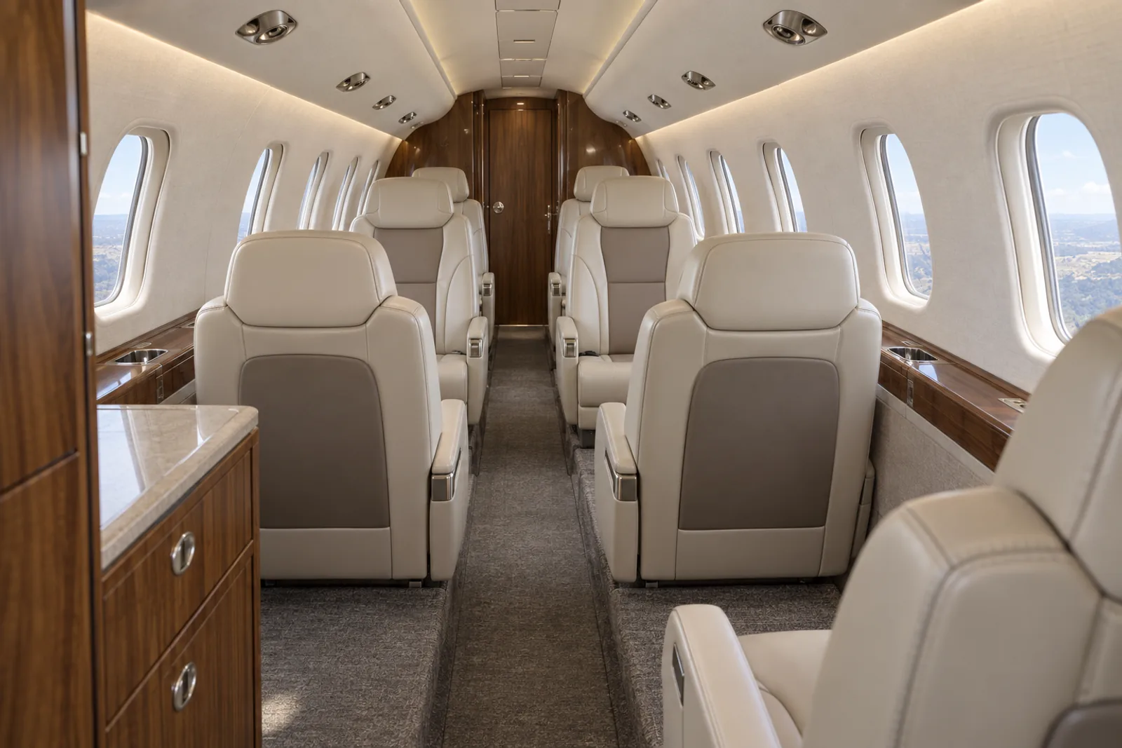 Representative Encore+ seven-main-seat cabin with a forward aft-facing chair, central club and aft pair