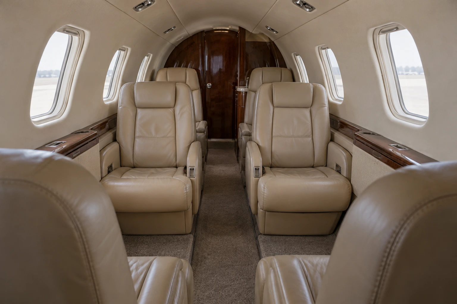Citation S/II seven-chair example. Illustrative interior, not a photograph of this aircraft.