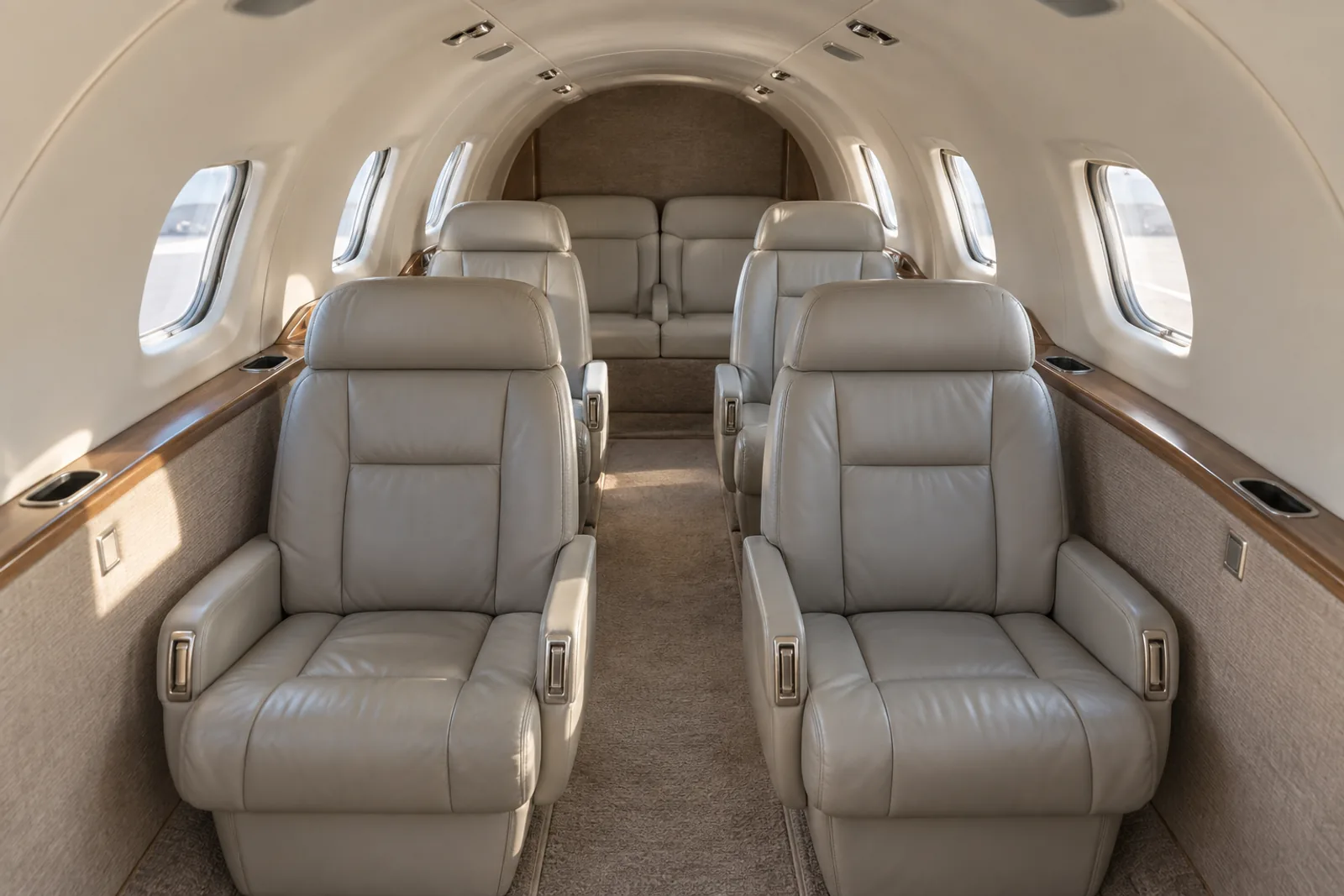 Original illustration of a representative Learjet 35 narrow cabin with four forward facing chairs and a two position aft divan. Individual completions vary